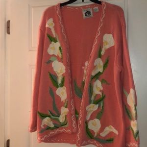 pink sweater with white flowers